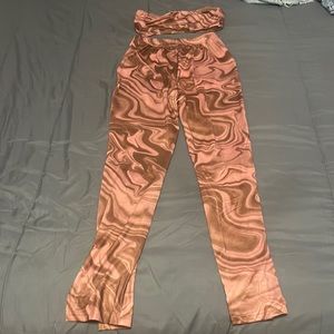 Brand New 2 piece pants 
Size Extra Small but really a Small